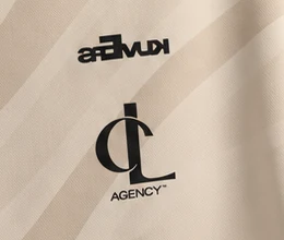 The crest of the official CL Agency jersey