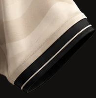 The cuffs of the official CL Agency jersey